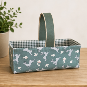 Handmade fabric basket in sage green bunny and mushroom print with sage gingham lining and grosgrain handle