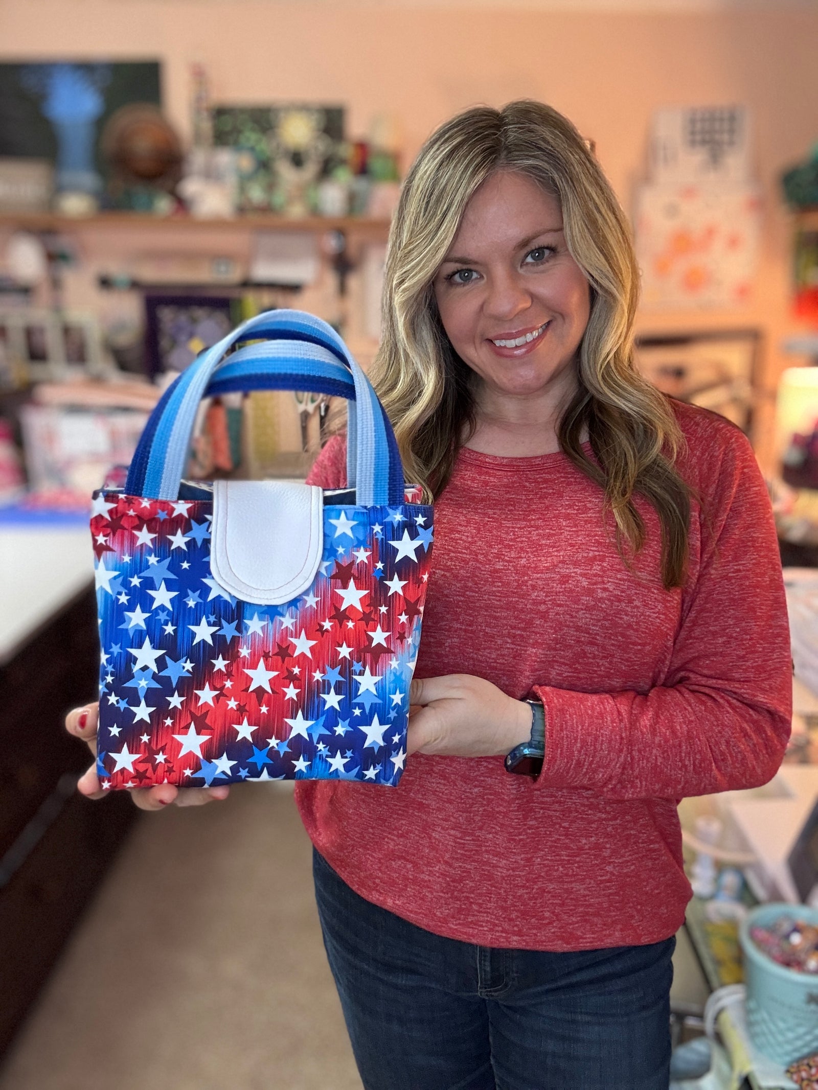 Colorful lunchbox with food on a checkered blanket in a park