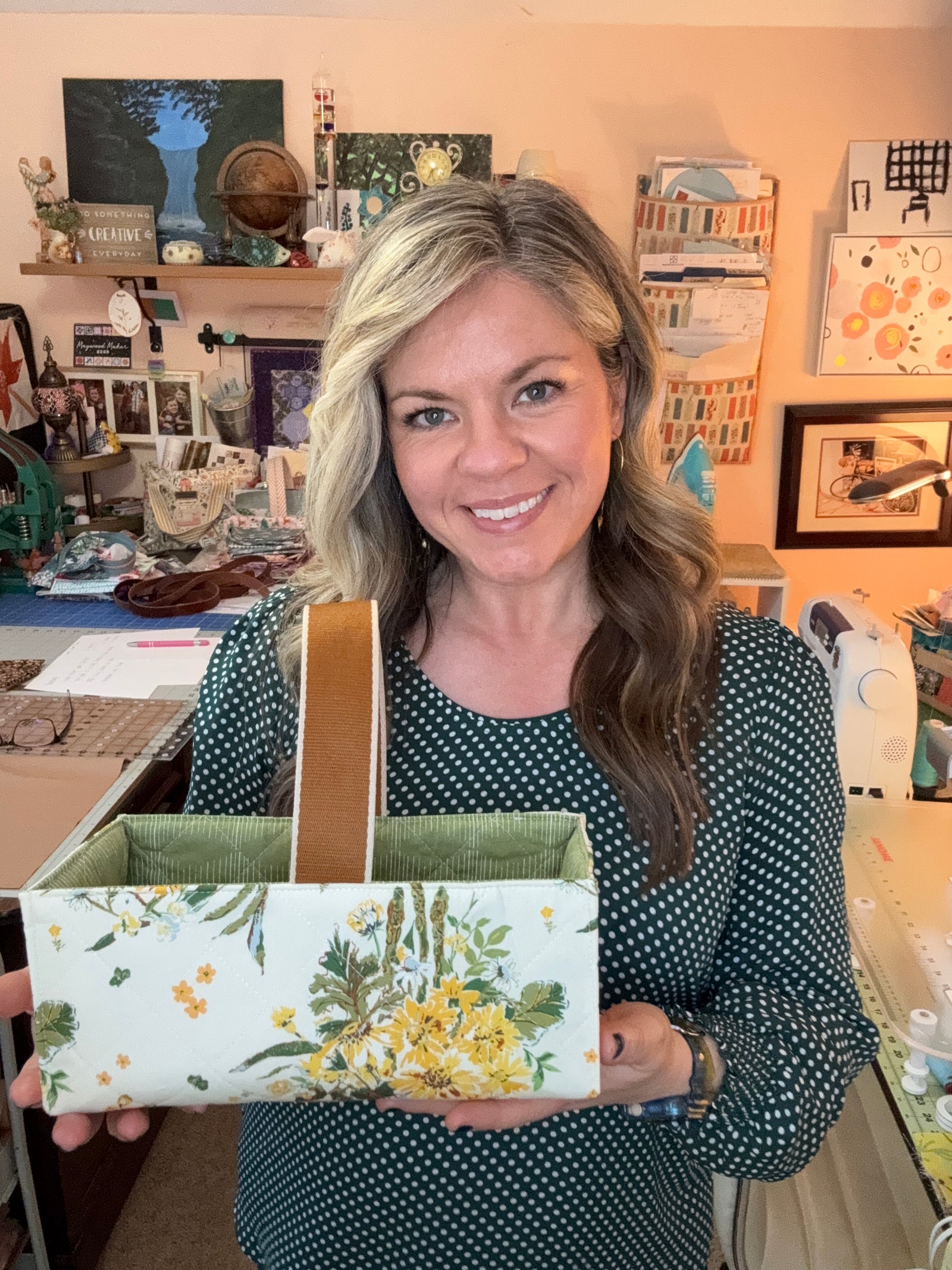 Floral sewing basket with sewing supplies on a table