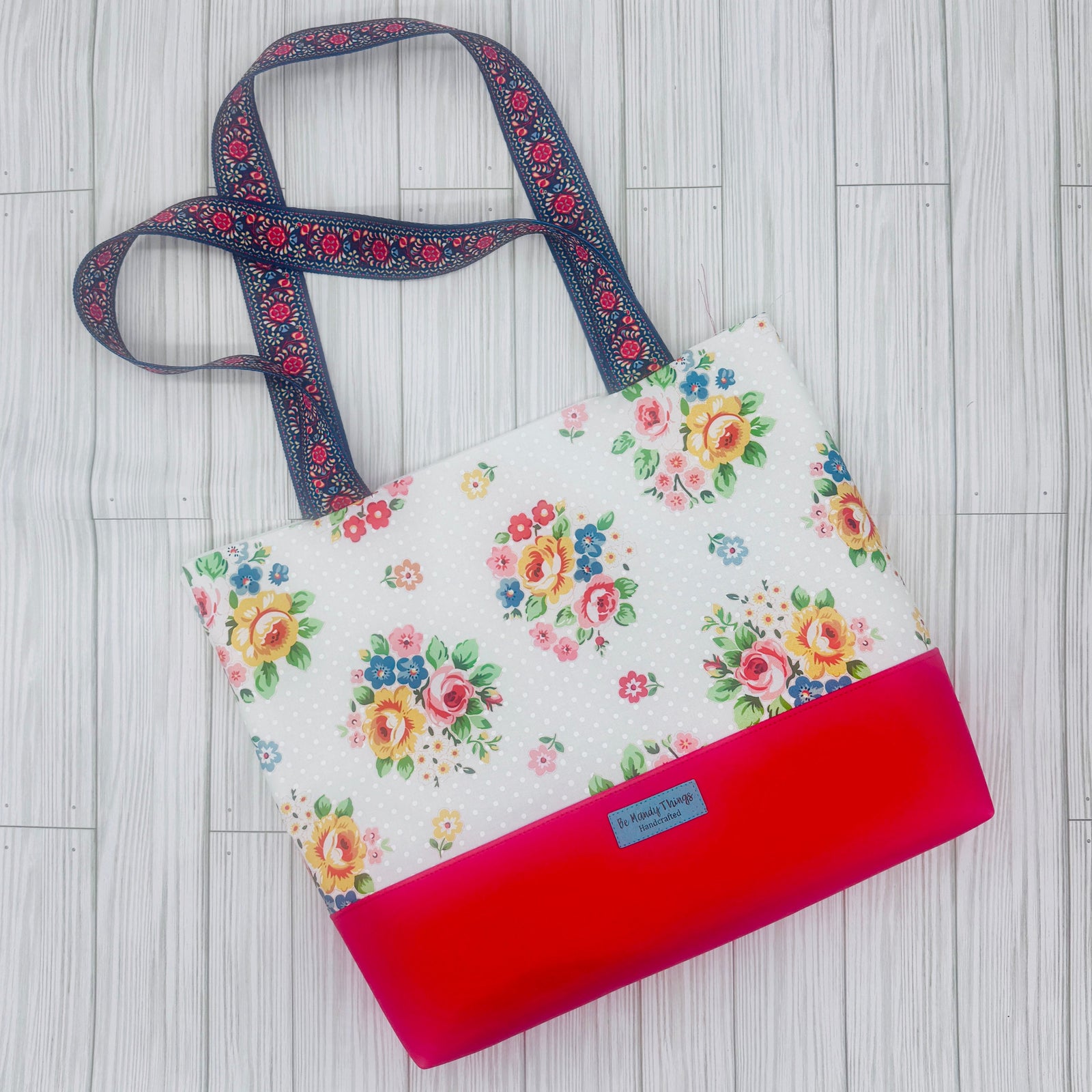floral tote with faux leather bottom