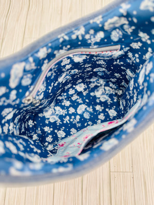 Interior view of Be Mandy Things patchwork elise handbag for summer featuring floral lining and zipper pocket